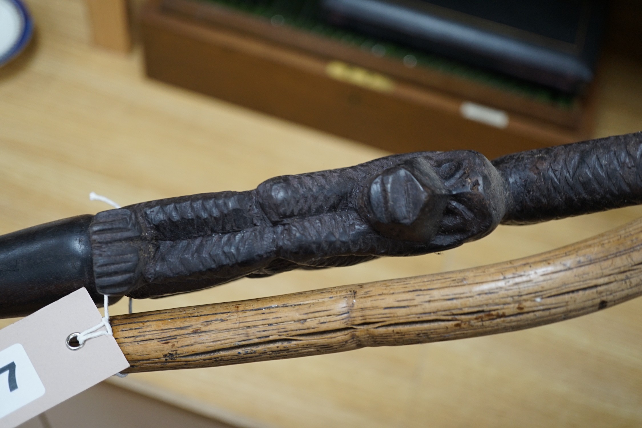 An African carved wood walking cane and a ‘dogs head’ walking cane